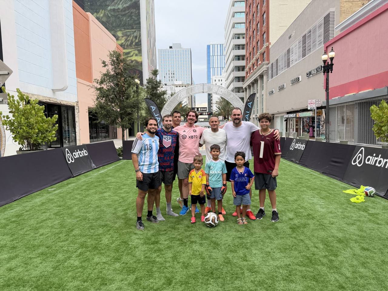 The full crew on the pitch between the boards